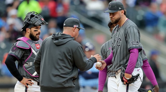 Jun 14, 2025; New York City, New York, USA; New York Mets starting pitcher Tylor Megill (38) hands the ball to manager Carlos Mendoza (64) during a pitching change during the fourth inning against the Tampa Bay Rays at Citi Field. Mandatory Credit: Brad Penner-Imagn Images