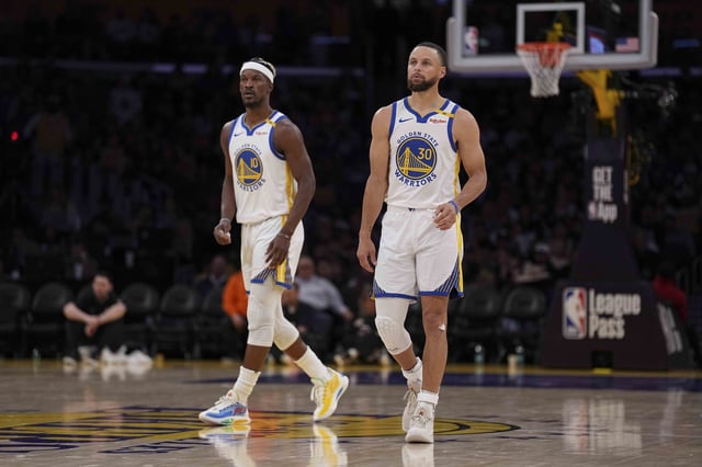 Stephen Curry #30 of the Golden State Warriors and Jimmy Butler III #10 of the Golden State Warriors look on against the Los Angeles Lakers during the second half of a game at Crypto.com Arena on April 03, 2025 in Los Angeles, California.