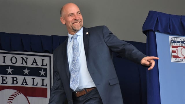 John Smoltz acknowledges the crowd during the introduction of returning inductees at the National Baseball Hall of Fame's 2024 induction ceremony Sunday, July 21, 2024, at the Clark Sports Center in Cooperstown, New York.