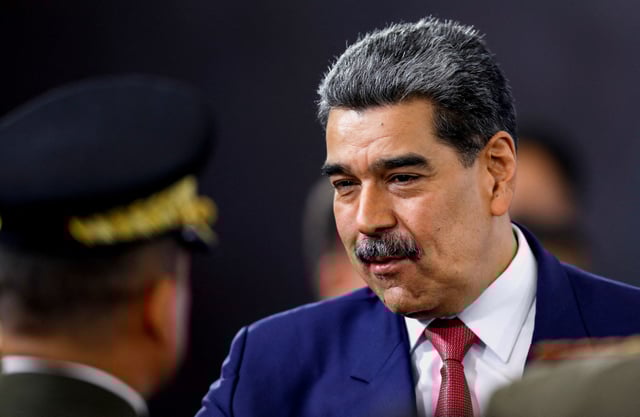 Venezuela's President Nicolas Maduro prepares to leave at the end of a press conference, days after he said Venezuela would deploy military, police and civilian defenses at 284 "battlefront" locations across the country, amid heightened tensions with the U.S., in Caracas, Venezuela, September 15, 2025. REUTERS/Leonardo Fernandez Viloria/File Photo