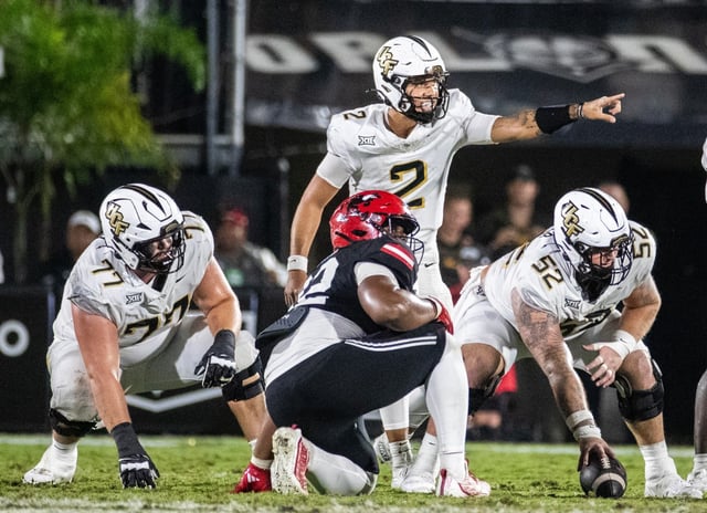UCF Knights quarterback Tayven Jackson (2) makes an adjustment to the play at the line of scrimmage during the second half of the football game against Jacksonville State at Acrisure Bounce House Stadium in Orlando, Fla., Thursday, Aug. 28, 2025. (Willie J. Allen Jr./Orlando Sentinel)