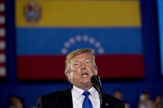 In this Monday, Feb. 18, 2019 photo, President Donald Trump speaks to a Venezuelan American community at Florida Ocean Bank Convocation Center at Florida International University in Miami, Fla., to speak out against President Nicolas Maduro's government and its socialist policies.
