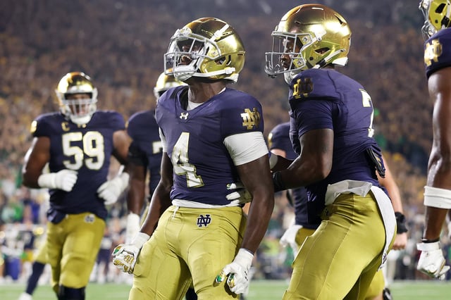 Jeremiyah Love #4 of the Notre Dame Fighting Irish celebrates a touchdown against the Texas A&M Aggies during the second half at Notre Dame Stadium on September 13, 2025 in South Bend, Indiana.