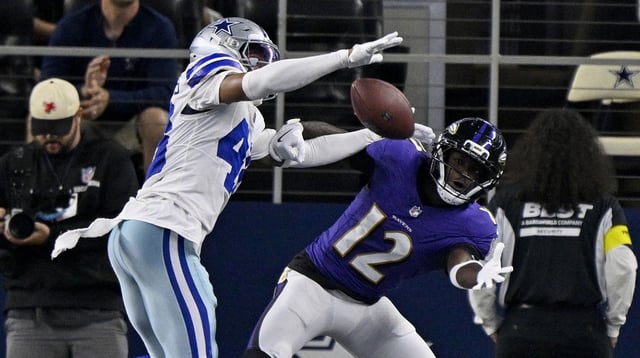 Aug 16, 2025; Arlington, Texas, USA; Dallas Cowboys cornerback Zion Childress (48) breaks up a pass intended for Baltimore Ravens wide receiver Malik Cunningham (12) during the second half at AT&T Stadium. Mandatory Credit: Jerome Miron-Imagn Images