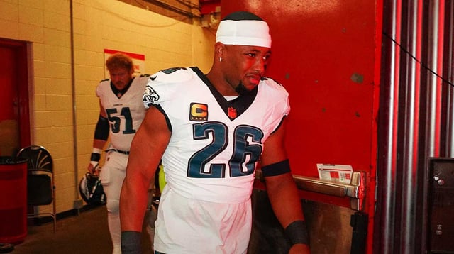Sep 14, 2025; Kansas City, Missouri, USA; Philadelphia Eagles running back Saquon Barkley (26) walks to the field prior to the game against the Kansas City Chiefs at GEHA Field at Arrowhead Stadium. Mandatory Credit: Denny Medley-Imagn Images