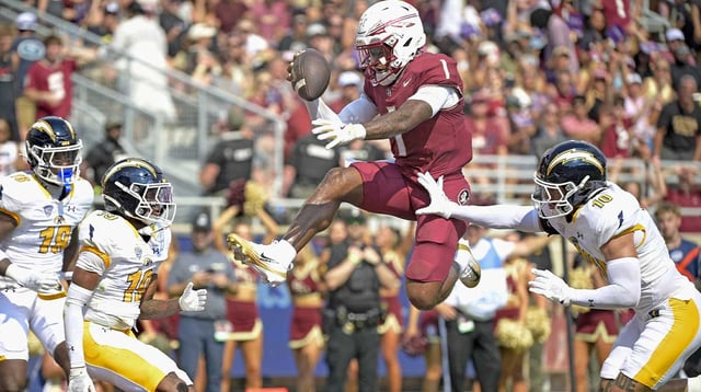 Sep 20, 2025; Tallahassee, Florida, USA; Florida State Seminoles quarterback Thomas Castellanos (1) scores a touchdown during the first half against the Kent State Golden Flashes at Doak S. Campbell Stadium. Mandatory Credit: Melina Myers-Imagn Images