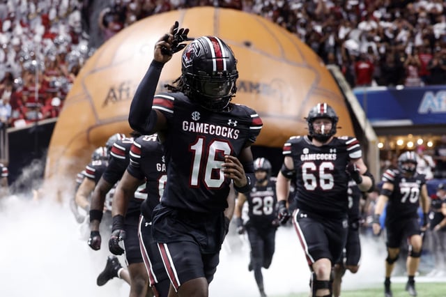 South Carolina Gamecocks players take the field before a football game against the Virginia Tech Hokies at Mercedes Benz Stadium on August 31, 2025 in Atlanta, Georgia.