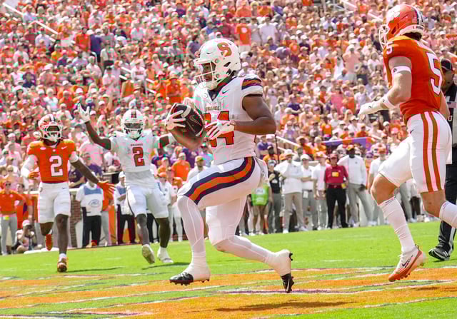 Syracuse Orange running back Will Nixon (24) scores a touchdown against the Clemson Tigers during the second quarter at Memorial Stadium.