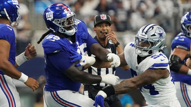 Sep 14, 2025; Arlington, Texas, USA; New York Giants offensive tackle James Hudson III (55) is called for a unnecessary roughness after a play against Dallas Cowboys defensive end Sam Williams (54) during the first quarter at AT&T Stadium. Mandatory Credit: Raymond Carlin III-Imagn Images