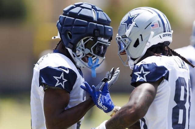 George Pickens #3 of the Dallas Cowboys celebrates with CeeDee Lamb #88 of the Dallas Cowboys during training camp practice at Staybridge Suites Oxnard on July 30, 2025 in Oxnard, California.