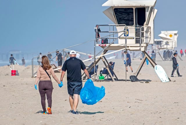 During the 41st annual California Coastal Cleanup Day on Saturday, Sept. 20, 2025, volunteers make a date of the cleanup and welcomed the change of seasons by scooping up trash at Huntington Beach. (Photo by Michael Goulding, Contributing Photographer)