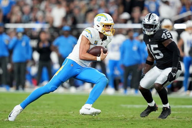 LAS VEGAS, NEVADA - SEPTEMBER 15: Justin Herbert #10 of the Los Angeles Chargers runs with the ball against the Las Vegas Raiders at Allegiant Stadium on September 15, 2025 in Las Vegas, Nevada. (Photo by Candice Ward/Getty Images)