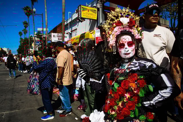Llesenia Toscano dons a Day of the Dead costume at the lowrider parade. “I’m born and raised here, but my blood is from Mexico,” Toscano said. 
