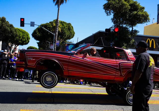 “King of the Streets,” the world’s first televised and streamed lowrider parade, rolls through San Francisco’s Mission District.