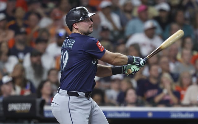 Sep 20, 2025; Houston, Texas, USA; Seattle Mariners catcher Cal Raleigh (29) hits a home run during the third inning against the Houston Astros at Daikin Park. Mandatory Credit: Troy Taormina-Imagn Images