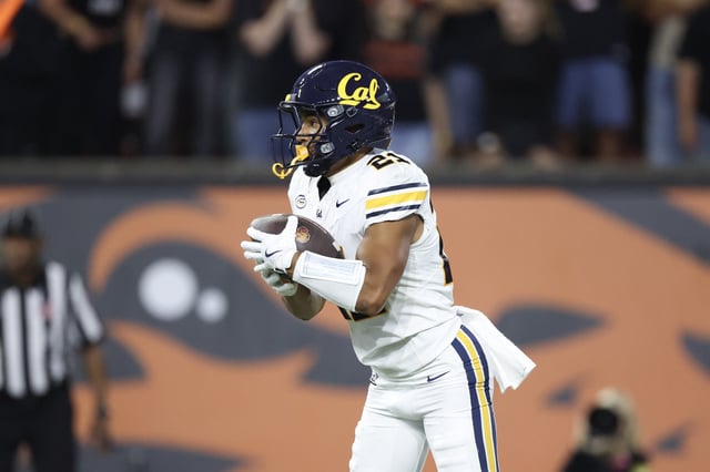 Wide receiver Jacob De Jesus #21 of the California Golden Bears carries against the Oregon State Beavers during the first half at Reser Stadium on August 30, 2025 in Corvallis, Oregon.