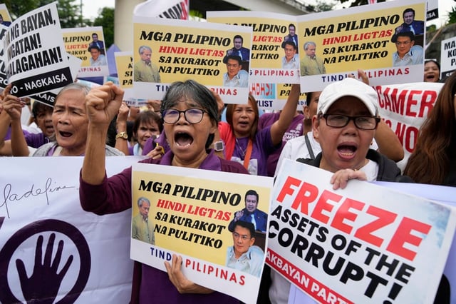 Protesters shout slogans as they hold a rally against corruption in Quezon City, the Philippines, on September 11. Photo: AP
