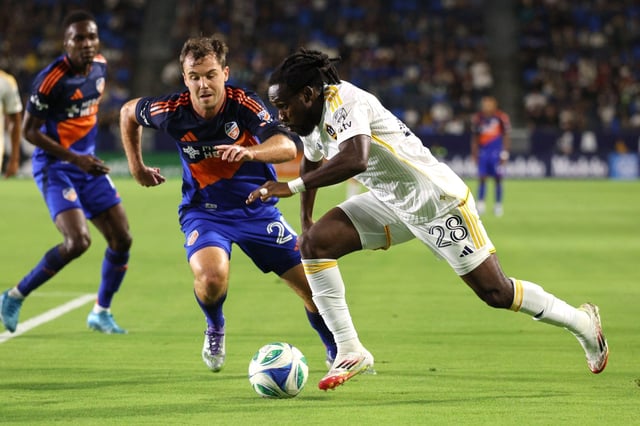LA Galaxy forward Joseph Paintsil (28) drives the ball chased by FC Cincinnati midfielder Pavel Bucha (20) during the first half of an MLS match at Dignity Health Sports Park in Carson, Calif. on Saturday, Sept. 20, 2025.  (Photo by Raul Romero Jr., Contributing Photographer)