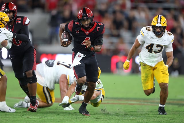 SAN DIEGO, CALIFORNIA – SEPTEMBER 20: Jayden Denegal #4 of the San Diego State Aztecs breaks from the pocket for extra rushing yards during the first half of a game against the California Golden Bears at Snapdragon Stadium on September 20, 2025 in San Diego, California.  (Photo by Sean M. Haffey/Getty Images)
