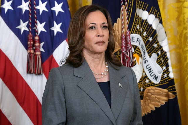 FILE - Vice President Kamala Harris listens during an event with President Joe Biden in the East Room of the White House in Washington, Sept. 26, 2024. (AP Photo/Susan Walsh, File)