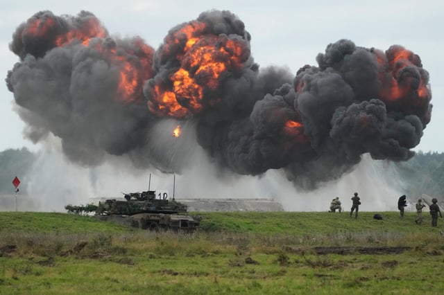 Smoke rises as Poland is staging its biggest military exercise of the year this week, bringing together more than 30,000 troops from the Polish armed forces and allied NATO nations in Orzysz, Poland, Wednesday, Sept. 17, 2025. (AP Photo/Czarek Sokolowski)
