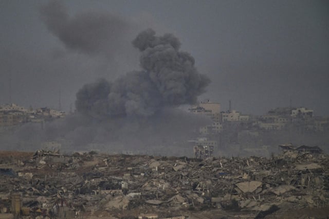 Smoke rises to the sky following an Israeli military strike in the northern Gaza Strip, as seen from southern Israel, Saturday, Sept. 20, 2025. (AP Photo/Leo Correa)