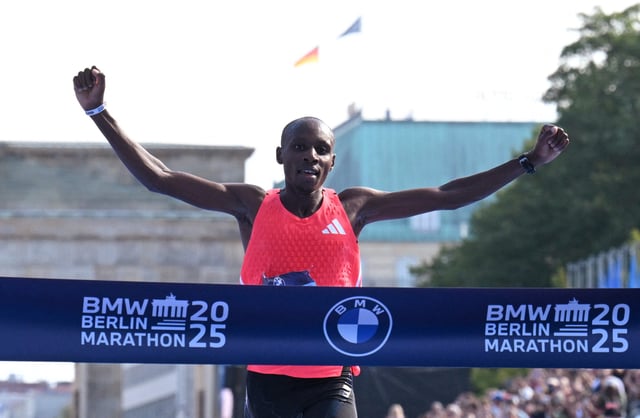 Athletics - Berlin Marathon - Berlin, Germany - September 21, 2025 Kenya's Sabastian Sawe crosses the line to win the Men's elite race REUTERS/Annegret Hilse