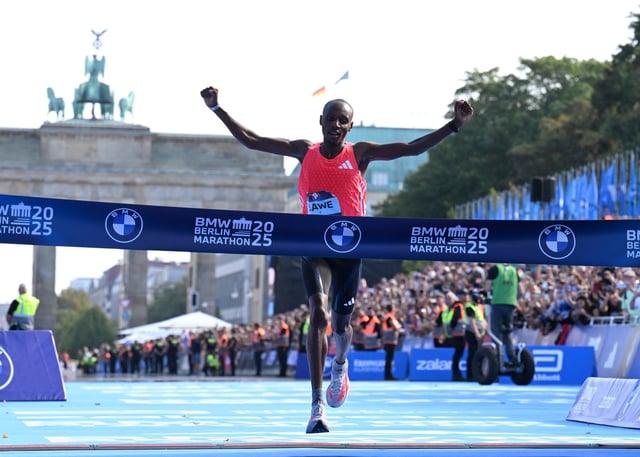 Athletics - Berlin Marathon - Berlin, Germany - September 21, 2025 Kenya's Sabastian Sawe crosses the line to win the Men's elite race REUTERS/Annegret Hilse