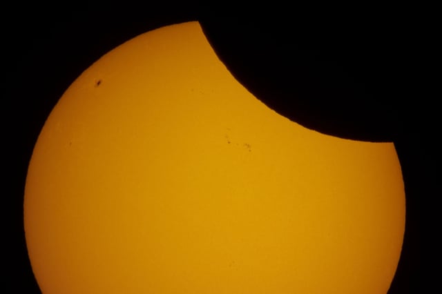 A view of a partial solar eclipse over St. Petersburg, Russia, Saturday, March 29, 2025. (AP Photo/Dmitri Lovetsky)