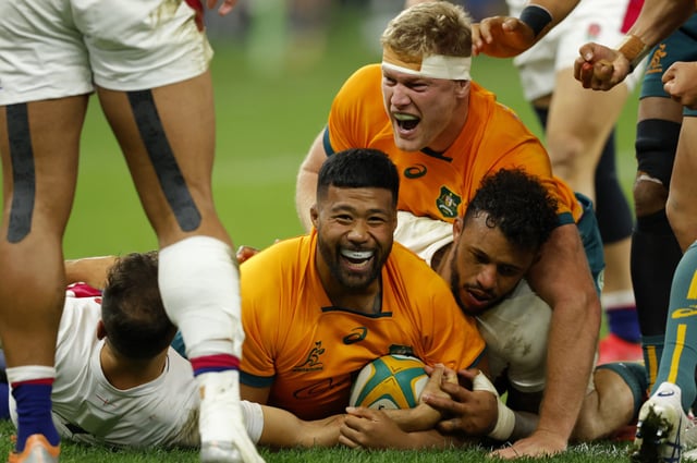 PERTH, AUSTRALIA - JULY 02: Folau Fainga’a of the Wallabies celebrates his try during game one of the international test match series between the Australian Wallabies and England at Optus Stadium on July 02, 2022 in Perth, Australia. (Photo by James Worsfold/Getty Images)