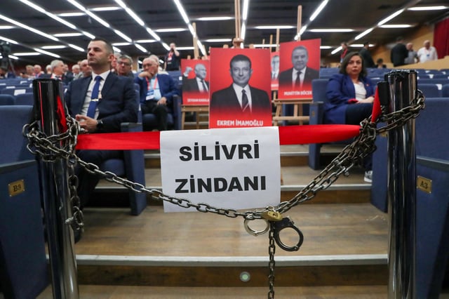 Portraits of jailed mayors, including one of Istanbul Mayor Ekrem Imamoglu displayed with symbolic props such as chains, handcuffs, and a banner referencing Silivri Prison, are presented as a political protest ahead of the opening session of Turkey's main opposition Republican People's Party (CHP) 22nd extraordinary congress in Ankara, Turkey, September 21, 2025. REUTERS/Cagla Gurdogan