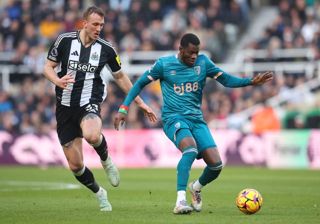 Dango Ouattara of AFC Bournemouth and Dan Burn of Newcastle United challenge during the Premier League match between Newcastle United FC and AFC Bournemouth at St James' Park on January 18, 2025 in Newcastle upon Tyne, England.