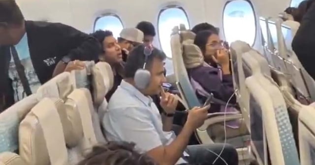 A screengrab shows passengers on Emirates flight EK226 to India from San Francisco which was delayed by three hours as passengers disembarked over worries they wouldn't be allowed back due to US visa changes. Photo: Fahad Naim / X