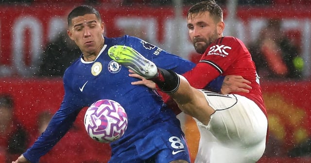 Manchester United's Luke Shaw, right, battles with Chelsea's Enzo Fernandez. Reuters