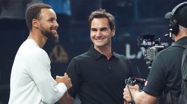 Sep 20, 2025; San Francisco, CA, USA; Golden State Warriors guard Stephen Curry greets Roger Federer before the coin toss at the Laver Cup at Chase Center. Mandatory Credit: David Gonzales-Imagn Images