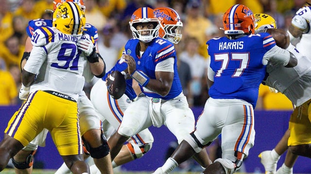 Sep 13, 2025; Baton Rouge, Louisiana, USA; Florida Gators quarterback DJ Lagway (2) against LSU Tigers defensive tackle Walter Mathis Jr. (91) during the second half at Tiger Stadium. Mandatory Credit: Stephen Lew-Imagn Images