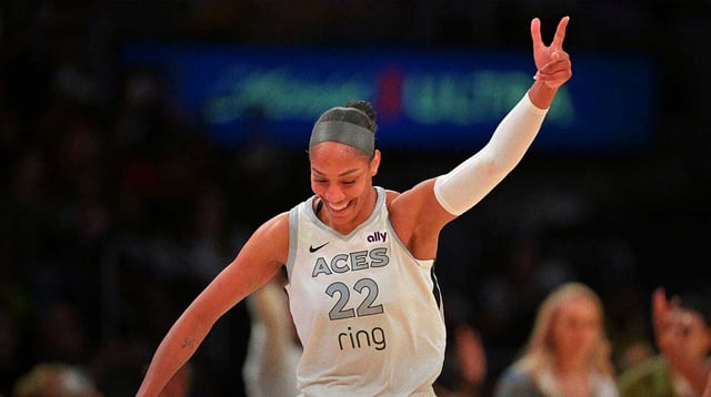 Sep 11, 2025; Los Angeles, California, USA; Las Vegas Aces center A'ja Wilson (22) celebrates after a 3 pointer during the second half against the Los Angeles Sparks at Crypto.com Arena. Mandatory Credit: Jayne Kamin-Oncea-Imagn Images