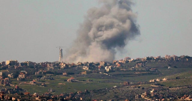 Smoke rises following a previous Israeli strike on the town of Bint Jbeil, as seen from the Israeli side of the border, in February. EPA