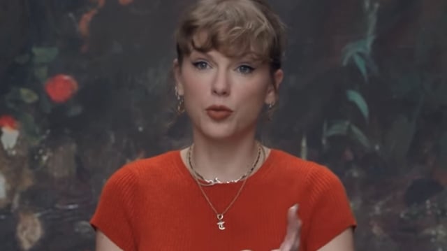 Taylor Swift wears a Showgirl orange Reformation cashmere sweater