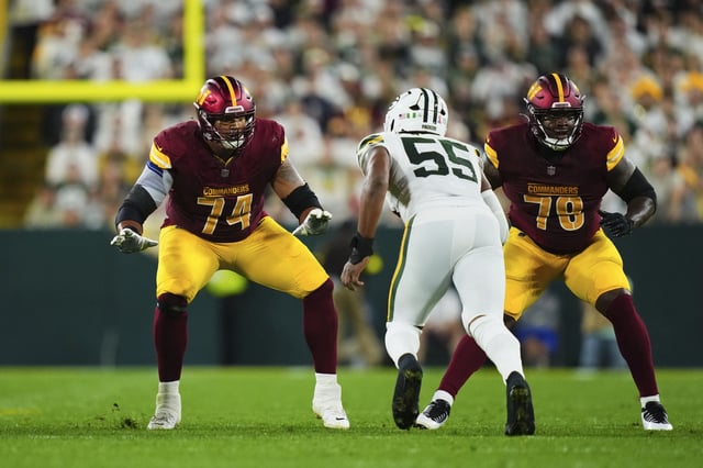 Brandon Coleman #74 of the Washington Commanders drops back to block during an NFL football game against the Green Bay Packers during at Lambeau Field on September 11, 2025 in Green Bay, Wisconsin.