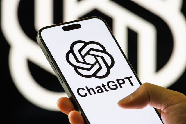 A smartphone displays the ChatGPT logo on its screen in this file image.