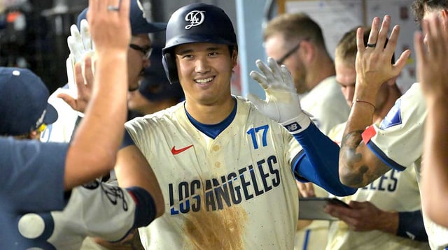 Sep 20, 2025; Los Angeles, California, USA; Los Angeles Dodgers designated hitter Shohei Ohtani (17) is congratulated in the dugout after hitting a solo home run in the fifth inning against the San Francisco Giants at Dodger Stadium. Mandatory Credit: Jayne Kamin-Oncea-Imagn Images
