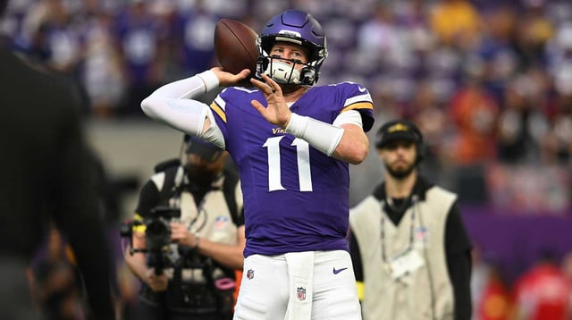 Sep 21, 2025; Minneapolis, Minnesota, USA; Minnesota Vikings quarterback Carson Wentz (11) warms up prior to a game against the Cincinnati Bengals at U.S. Bank Stadium. Mandatory Credit: Jeffrey Becker-Imagn Images