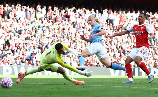 Soccer Football - Premier League - Arsenal v Manchester City - Emirates Stadium, London, Britain - September 21, 2025 Manchester City's Erling Haaland scores their first goal Action Images via Reuters/Matthew Childs EDITORIAL USE ONLY. NO USE WITH UNAUTHORIZED AUDIO, VIDEO, DATA, FIXTURE LISTS, CLUB/LEAGUE LOGOS OR 'LIVE' SERVICES. ONLINE IN-MATCH USE LIMITED TO 120 IMAGES, NO VIDEO EMULATION. NO USE IN BETTING, GAMES OR SINGLE CLUB/LEAGUE/PLAYER PUBLICATIONS. PLEASE CONTACT YOUR ACCOUNT REPRESENTATIVE FOR FURTHER DETAILS..
