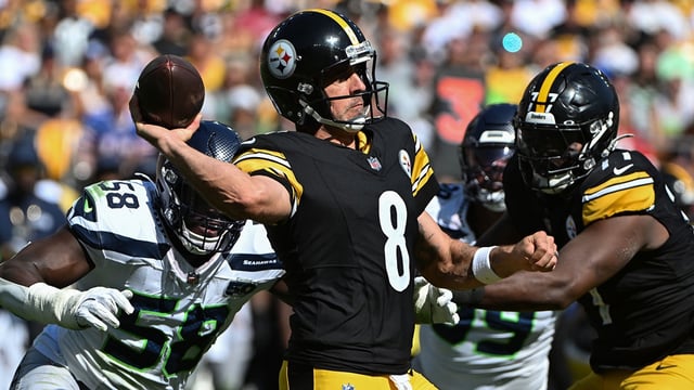 Sep 14, 2025; Pittsburgh, Pennsylvania, USA; Pittsburgh Steelers quarterback Aaron Rodgers (8) throws a pass while being pressured by Seattle Seahawks linebacker Derick Hall (58) during the second half at Acrisure Stadium. Mandatory Credit: Barry Reeger-Imagn Images