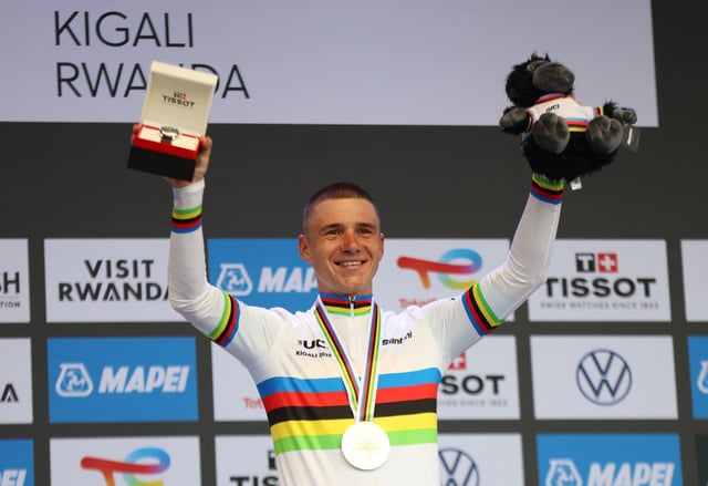 Cycling - Road World Championships 2025 - Kigali, Rwanda - September 21, 2025 Gold medallist, Belgium's Remco Evenepoel celebrates on the podium after winning the Men's Elite Individual Time Trial REUTERS/Jean Bizimana