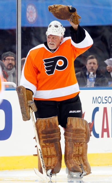 Former Flyers goalie Bernie Parent waves to the fans at the 2012 NHL Winter Classic Alumni game in Philadelphia.