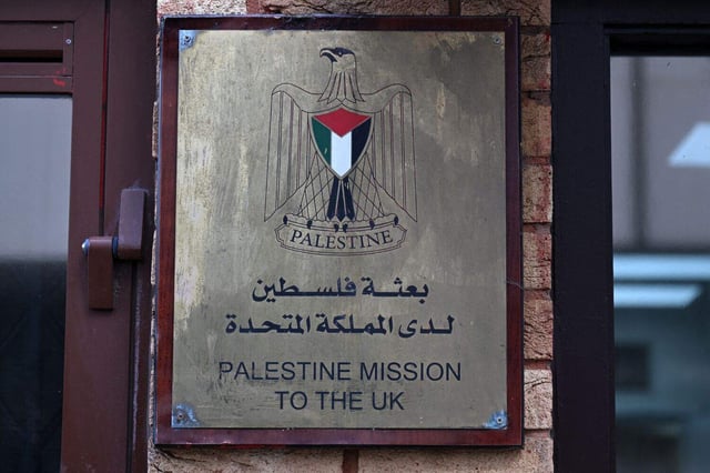 A sign is seen outside the Palestine Mission to the UK on September 21, 2025 in west London. UK Prime Minister Keir Starmer on Sunday said Britain was formally recognising a State of Palestine, in a historic shift in decades of British foreign policy. (Photo by JUSTIN TALLIS / AFP)