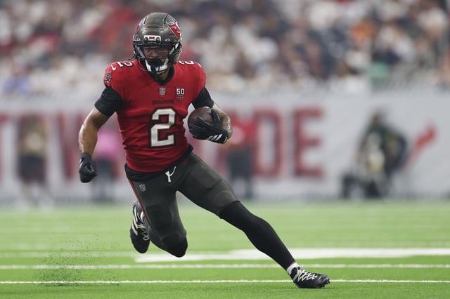 Emeka Egbuka #2 of the Tampa Bay Buccaneers runs the ball during the first half against Houston Texans at NRG Stadium on September 15, 2025 in Houston, Texas.