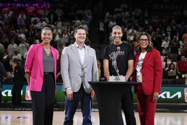 Sep 21, 2025; Las Vegas, Nevada, USA; Las Vegas Aces center A'ja Wilson (22) receives the 2025 WNBA Most Valuable Player award prior to game one of the second round for the 2025 WNBA Playoffs at Michelob Ultra Arena. Mandatory Credit: Lucas Peltier-Imagn Images
